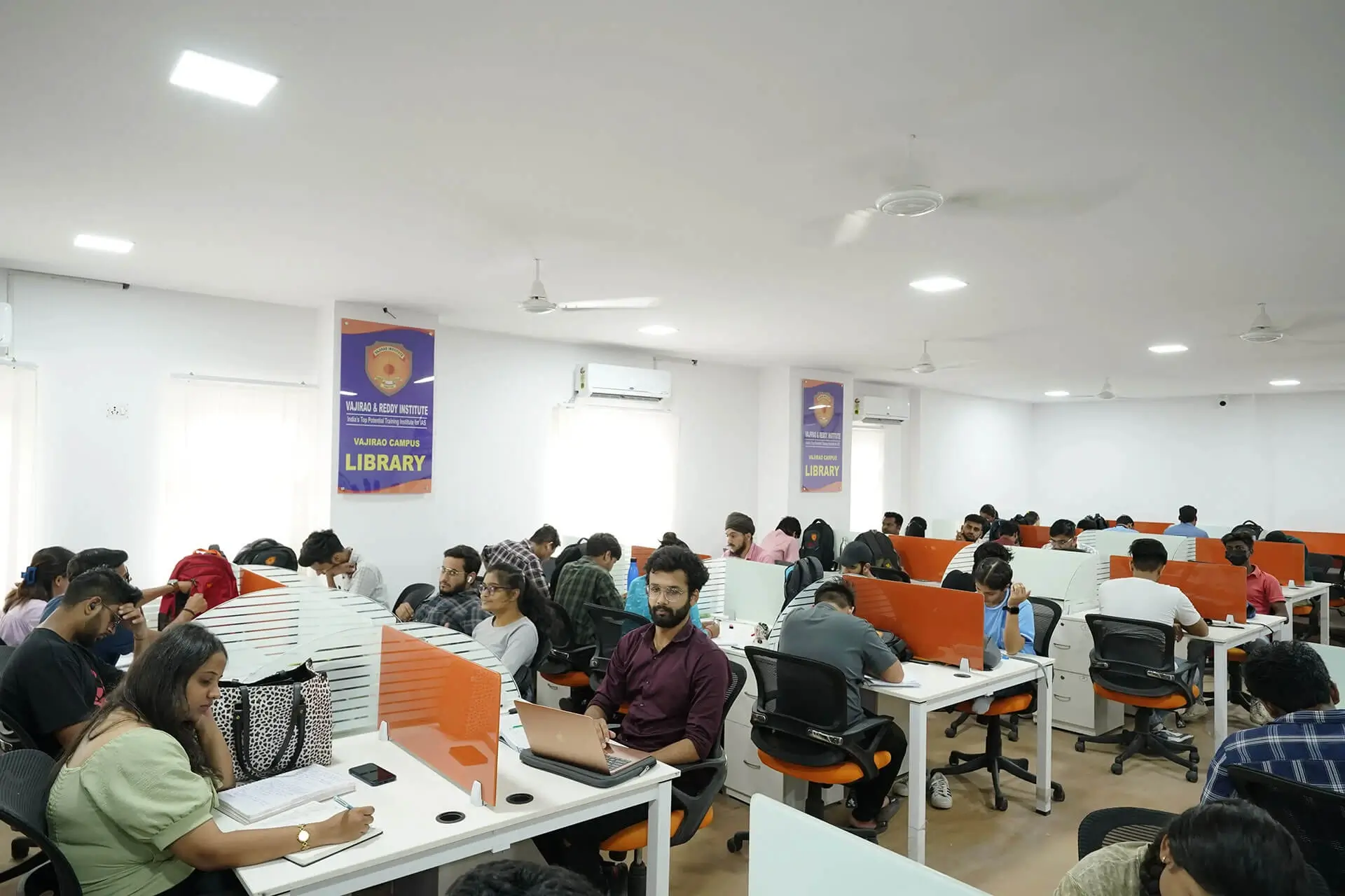 Civil services aspirants using the UPSC library reading space
